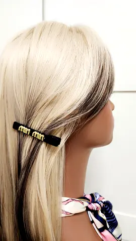Black velvet hair barrette with gold accents — gently used