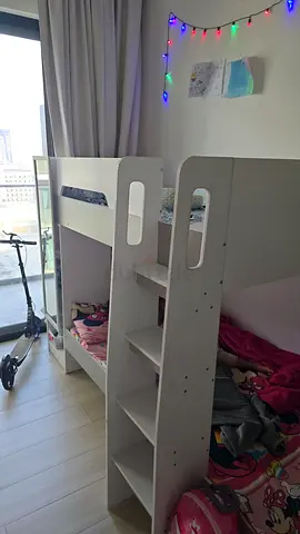 White wooden bunk bed with built-in shelving - good condition