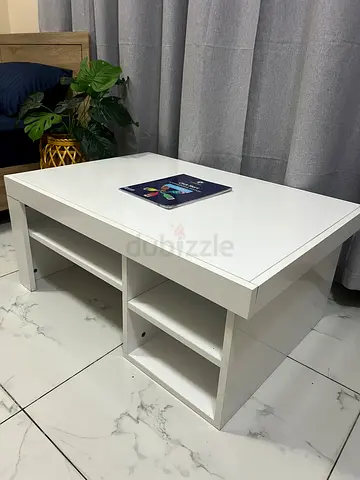 White wooden coffee table with storage shelves - 90x60 cm