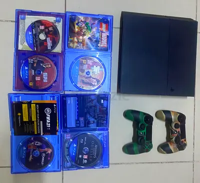 Ps4-Original-Fat-Black-Model with 2 Controllers and the Controller Covers and some Games