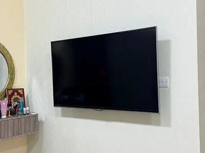 Wall-mounted 42-50" LED TV in good condition