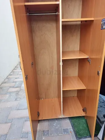 Used 3-door wooden wardrobe with shelves and hanging rail (good condition)