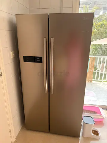 Used double-door refrigerator - good condition, stainless finish