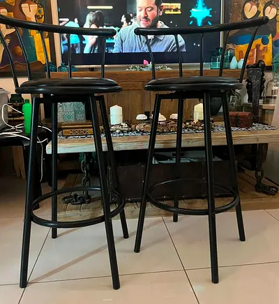 Pair of Black Metal Swivel Stools coverd with leather