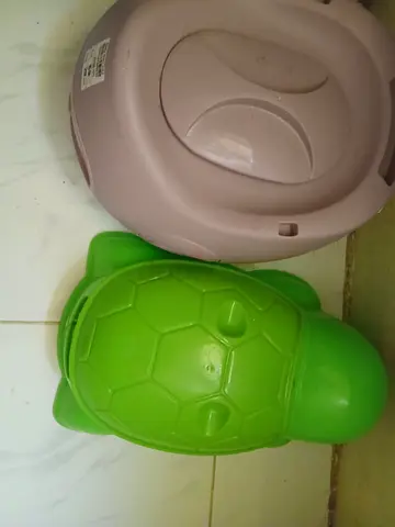Two baby potties (one turtle-shaped) - good used condition