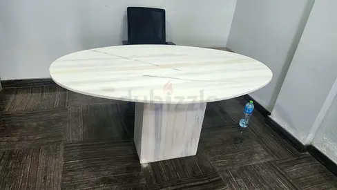 Round white marble dining/meeting table with pedestal base