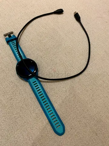 Blue smart watch with charging cable - good working condition