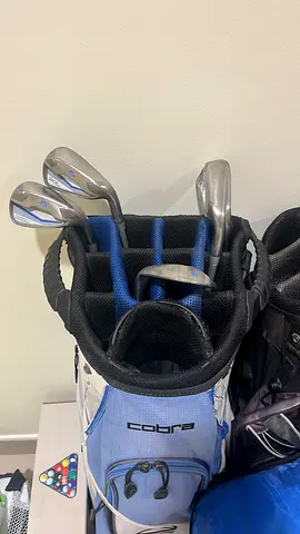 Cobra golf bag with mixed set of irons - good condition