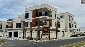 Luxury villa for sale in Al Alia, Ajman | Corner villa on two streets, two floors and a roof terrace