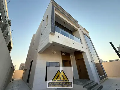 Luxury villa with modern finishes, 5 master bedrooms, in the Al Zahia area, behind the shopping complex and main roads.
