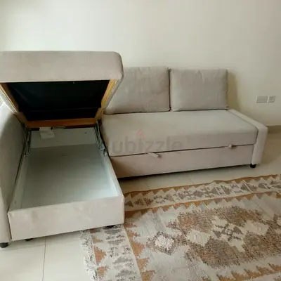Light beige storage sofa bed - compact 2-seater with under-seat storage