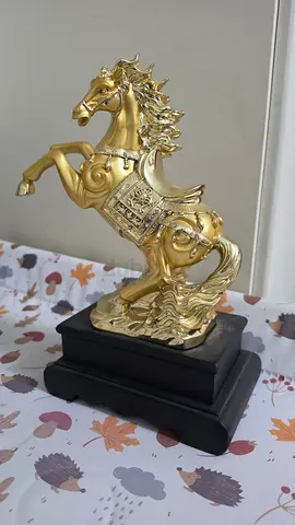 Gold Colored Horse Statue on Black Base