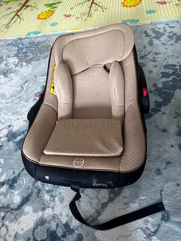 Beige infant car seat (rear-facing) - good condition