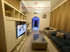 A fully furnished two-bedroom apartment with a living room in Al Taawun for monthly rent with intern