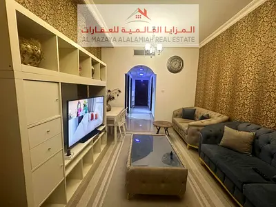 A fully furnished two-bedroom apartment with a living room in Al Taawun for monthly rent with internet