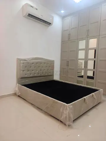 Queen size upholstered bed frame with tufted headboard - like new