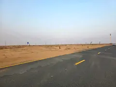 Residential land for sale in Sharjah - Rawdat Al Qurt area - Al Ruwaidat suburb