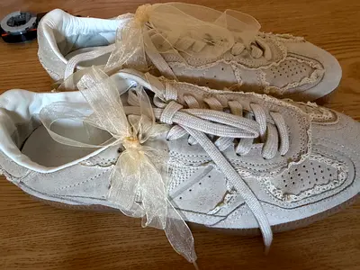 Women's beige lace-trim suede sneakers, size not marked