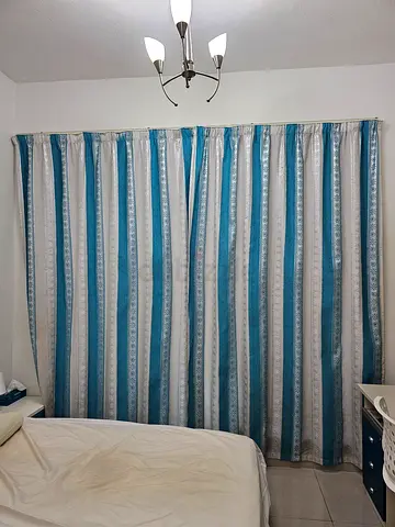 Blue and white Curtains with rails
