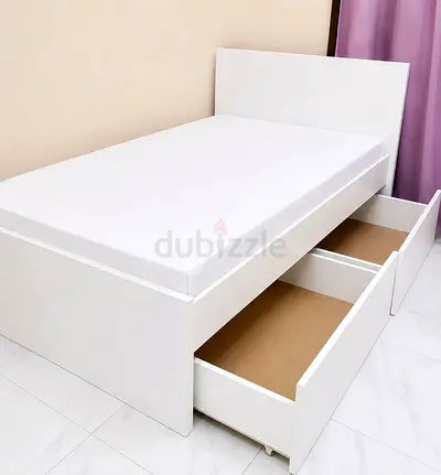 Single white storage bed with two pull-out drawers