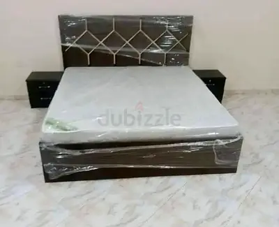 King-size bed frame with mattress and two bedside tables - new