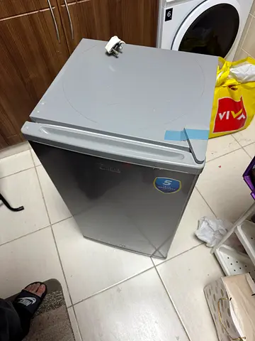 Compact single-door mini fridge — good working condition new