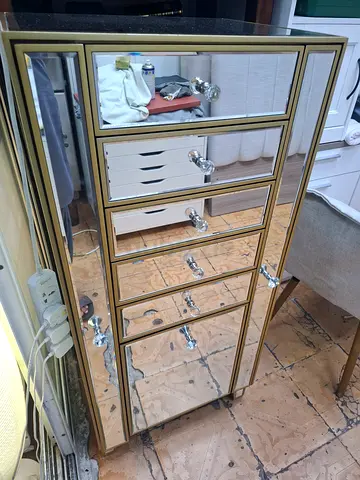 Tall mirrored wardrobe/armoire with multiple drawers - gold trim