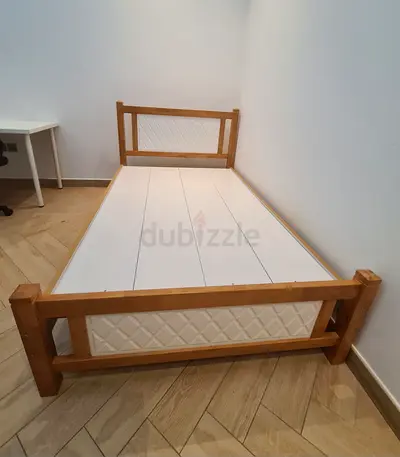 Twin wooden bed frame with white panels - good condition