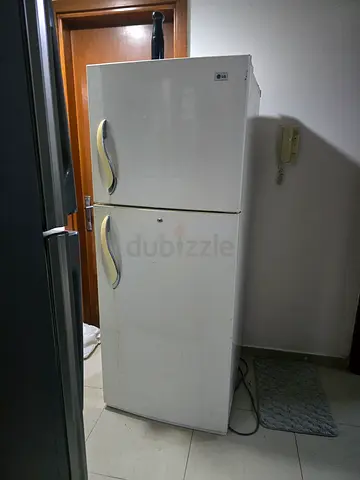 Used white double-door refrigerator/freezer - good working condition