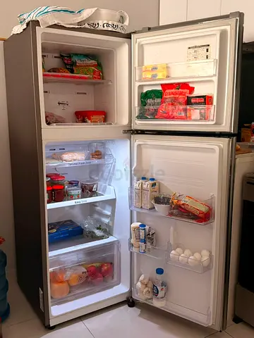 Used top-freezer refrigerator in good working condition, 2-door
