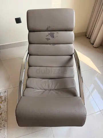 Used modern rocking grey lounge chair with chrome frame
