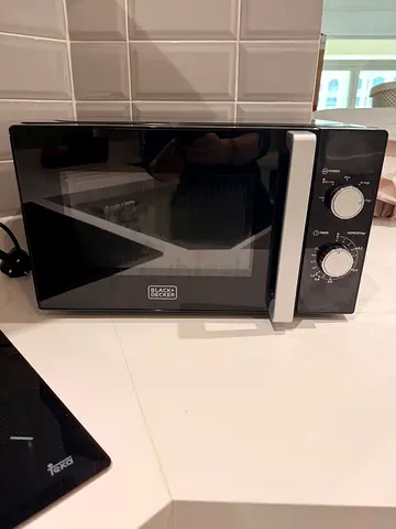Black countertop microwave in good condition