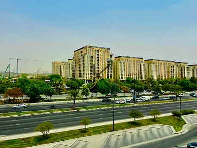 Luxury light brand new one bedroom with balcony with wardrobe in front of Almamasha community