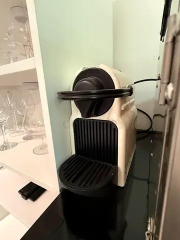 Compact capsule coffee machine - working, white