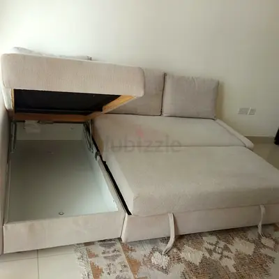 Beige L-Shaped Sofa Bed with Integrated Storage