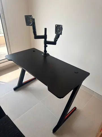 Black ergonomic gaming/office desk with dual monitor mount