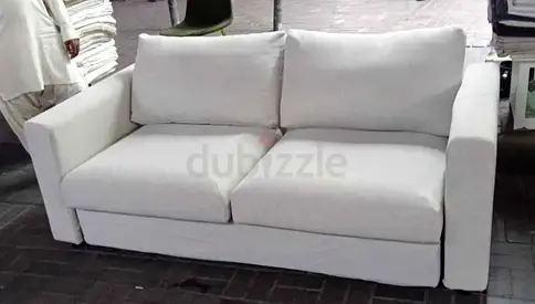 Beige 2-seater sofa bed- clean, comfortable, good condition