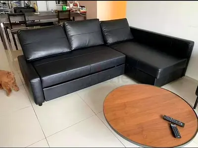 Black L-shaped Leather Sofa Bed with Storage — Good Condition