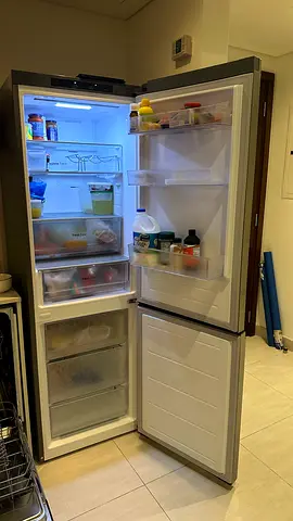 Used stainless steel bottom-freezer refrigerator - good condition