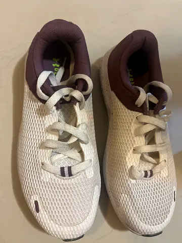 White lightweight women's sneakers, size not specified, gently used
