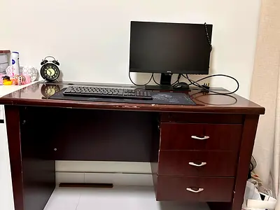 Wooden office desk with three drawers