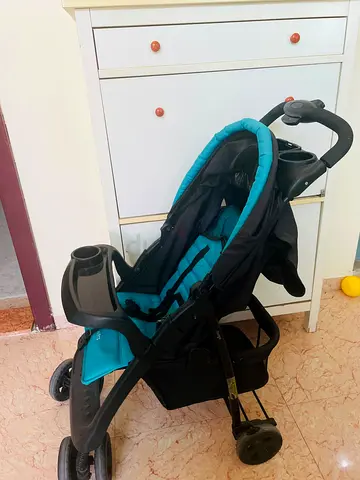 Lightweight teal and black standard baby stroller - good condition