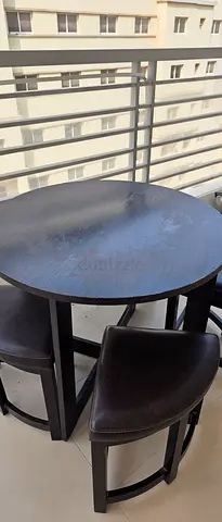 Wooden round dining table , Malaysian, with leather chairs