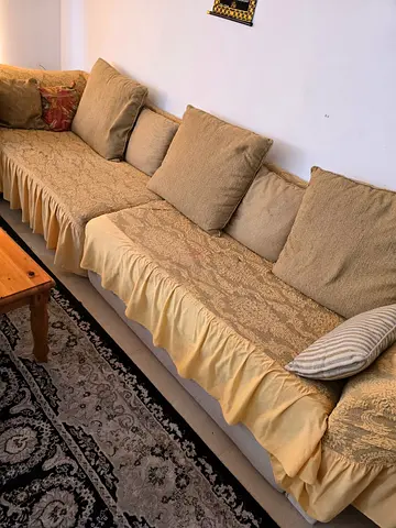Long beige living room sofa with removable covers - good condition