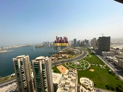 A two-bedroom apartment with a living room and maid’s room in Al Majaz 2, featuring an open sea view, parking, and a gym. Special offer: 45 days free