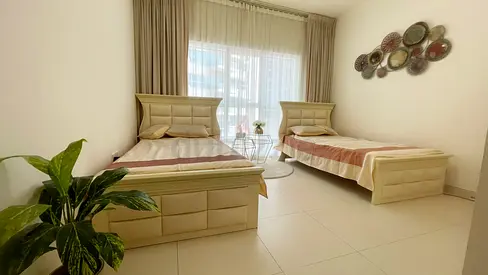 Pair of single beds with almost-new pillow-top spring mattresses, in excellent condition
