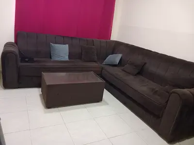 L Shaped Sofa with a center table Very Good condition