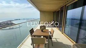 PRICED REDUCED | PALM & SUNSET VIEW | ONE OF THE HIGHEST FLOORS