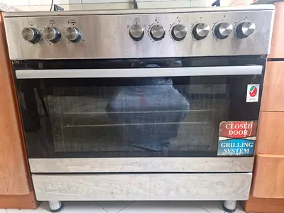 Used stainless steel freestanding gas oven with grill - 5 burners