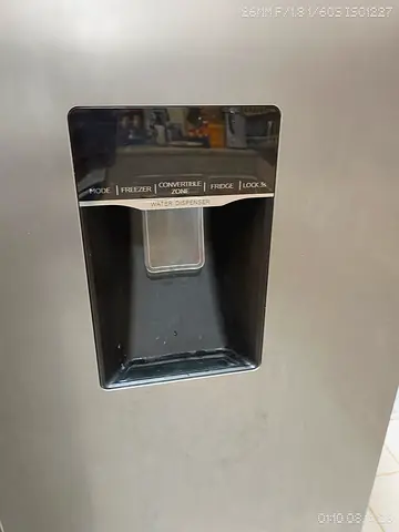Stainless Steel Refrigerator with Water Dispenser (side view)